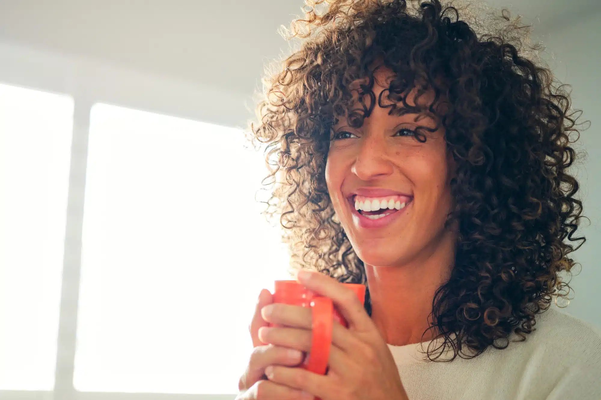 A woman enjoying her cup of kratom tea to boost her day