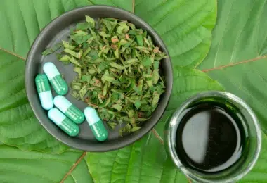 Kratom Capsules with Kratom Tea and leaves